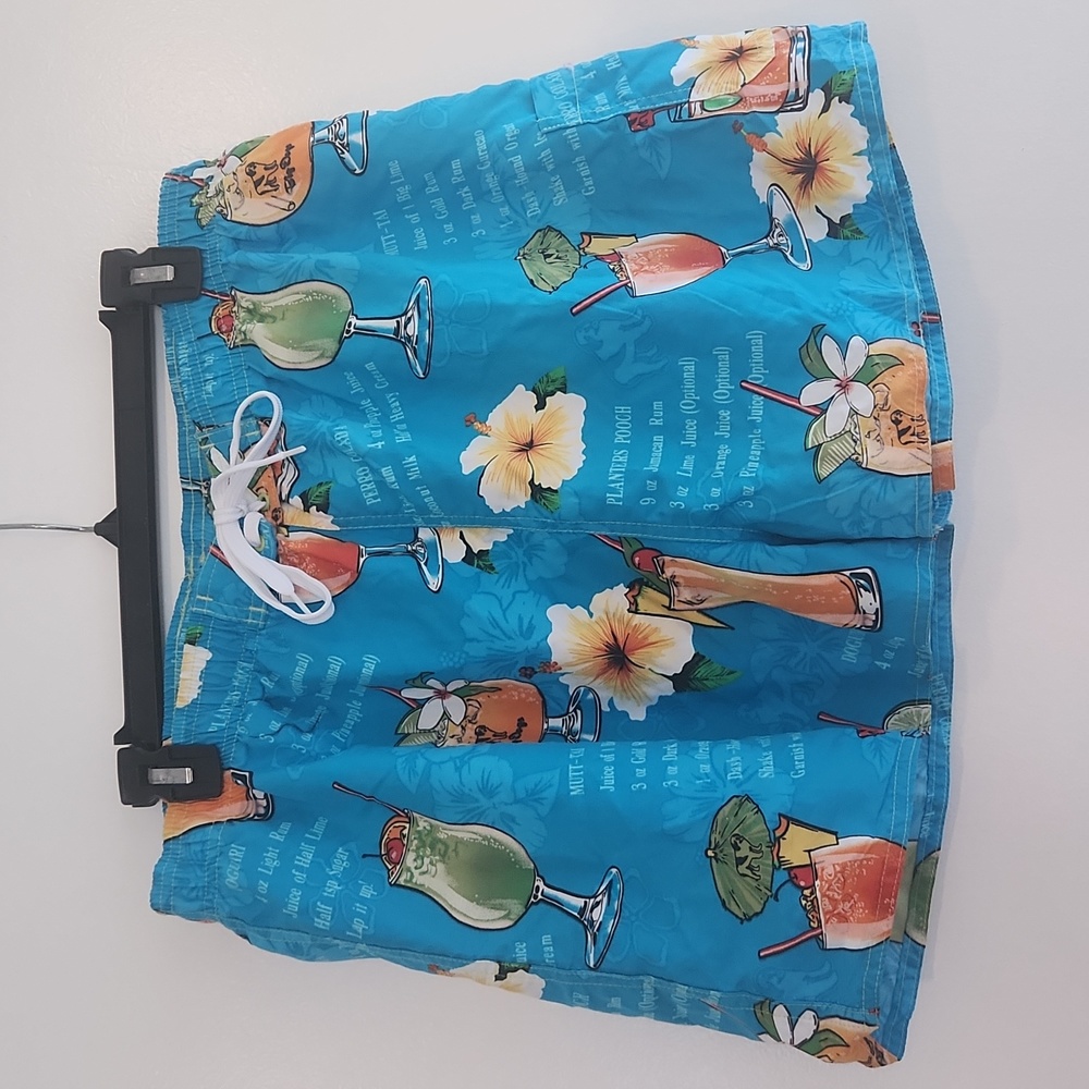 Ladies turquoise xlg tropical shorts with cocktails and recipes.
